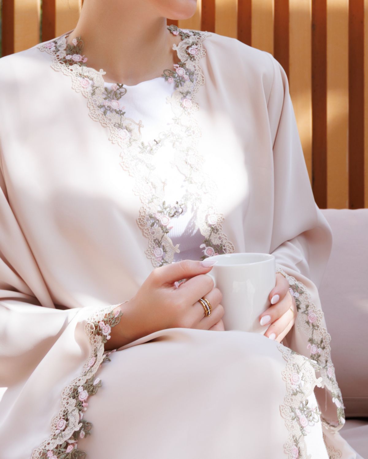 Embroidered lace abaya and a cup of tea